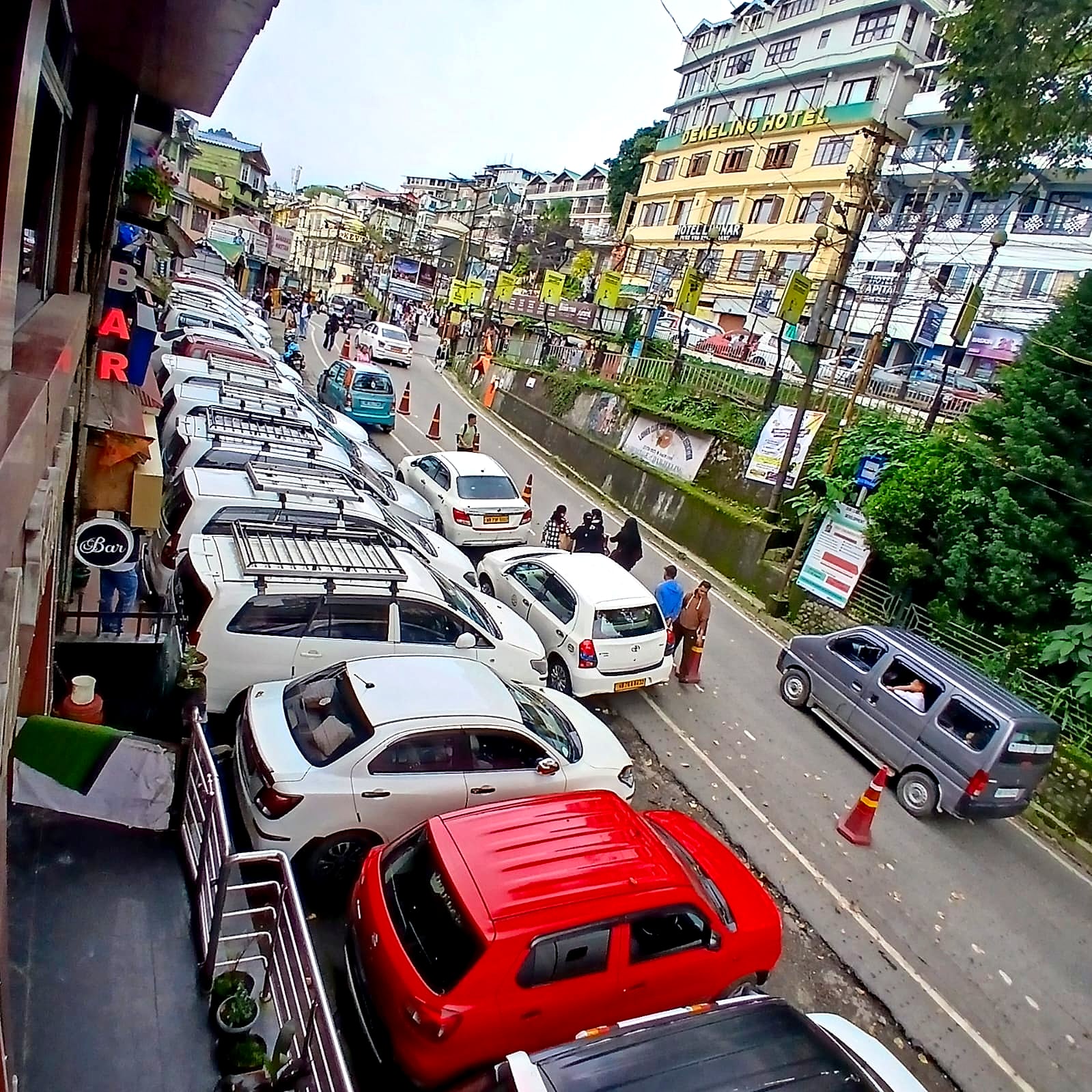 The Club Side motor stand directly below Hotel Charlie, with shared jeeps and taxis lined up